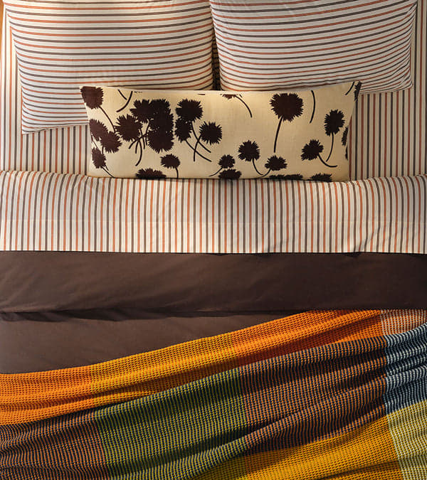 Layered bedding on a made bed