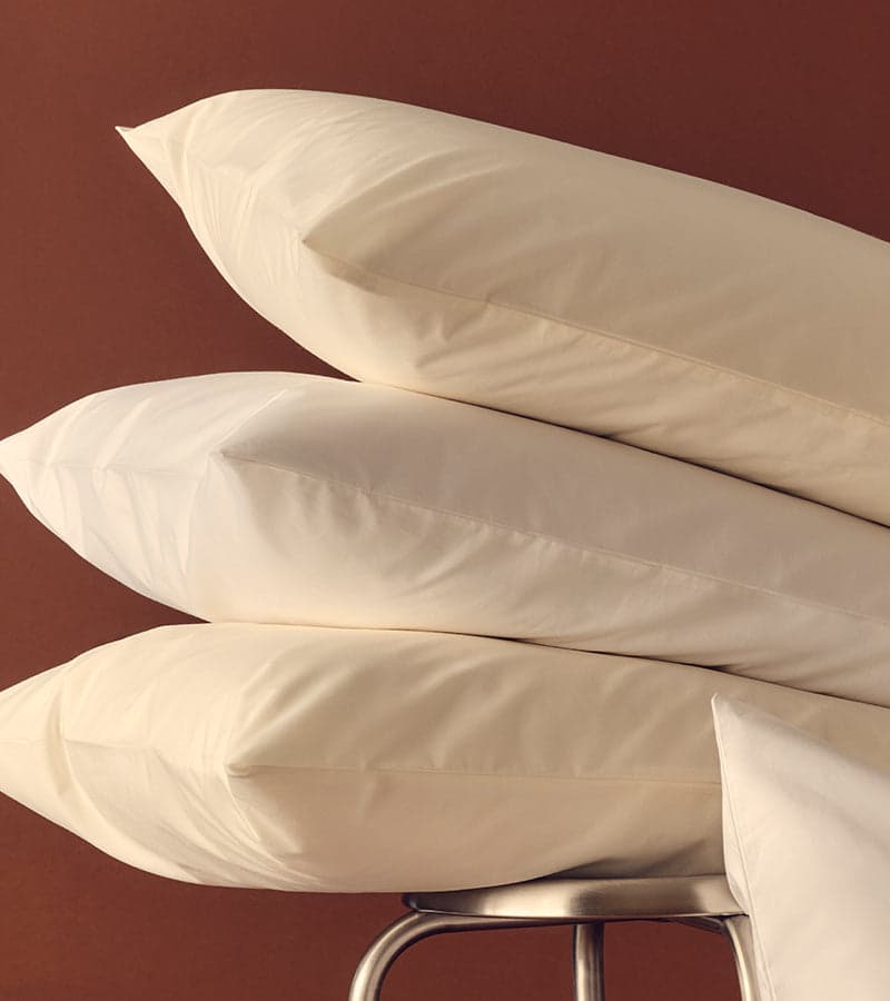 White sheets on a made bed