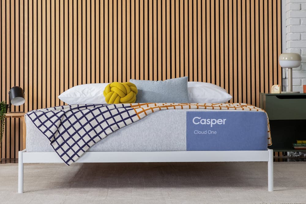 Two Casper mattresses, the One and Cloud One, on a wooden, split king-sized bed frame