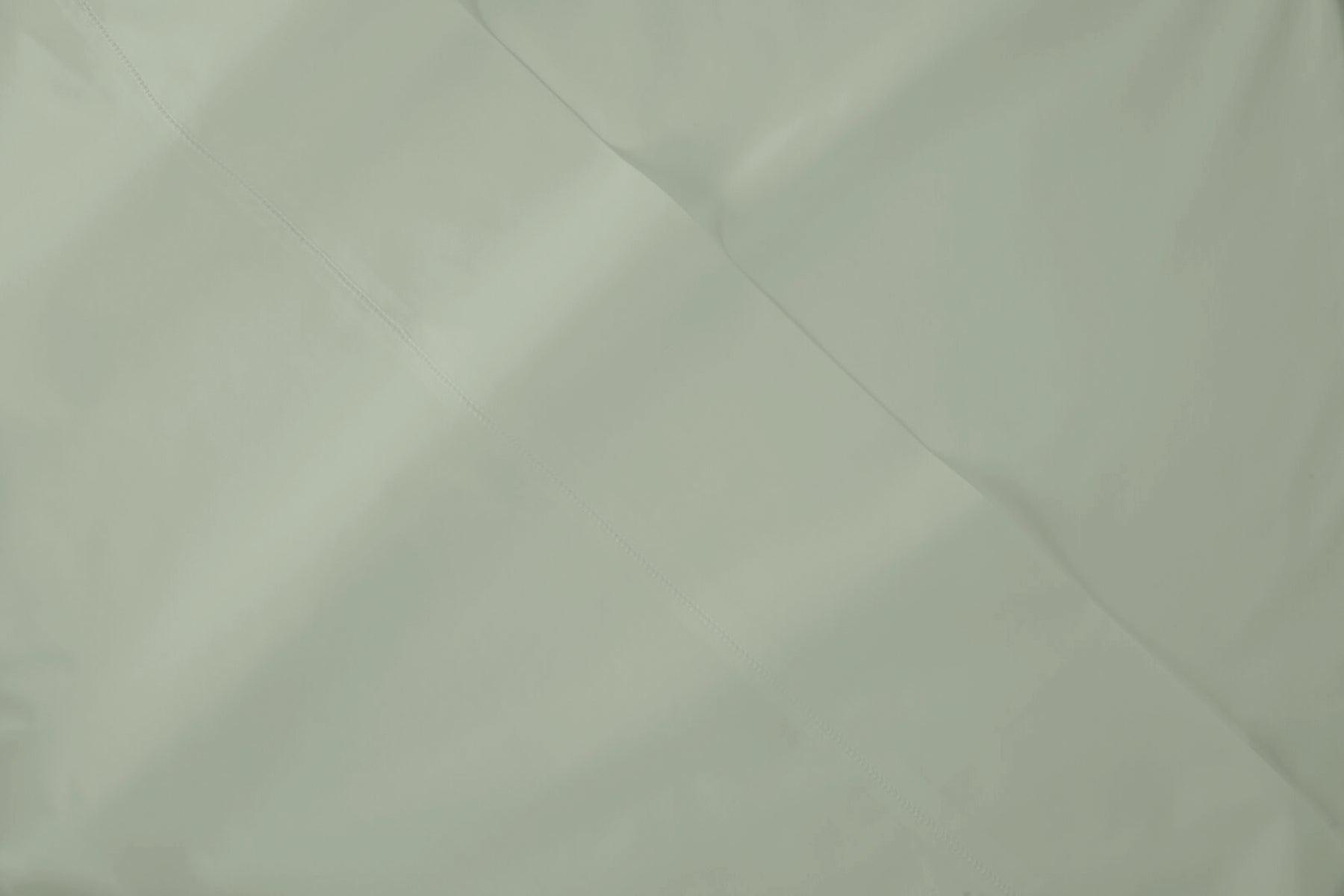 Close-up view of Percale fabric in eucalyptus-green colorway