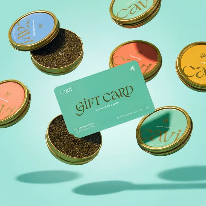 The CAVI gift card floating among open caviar tins