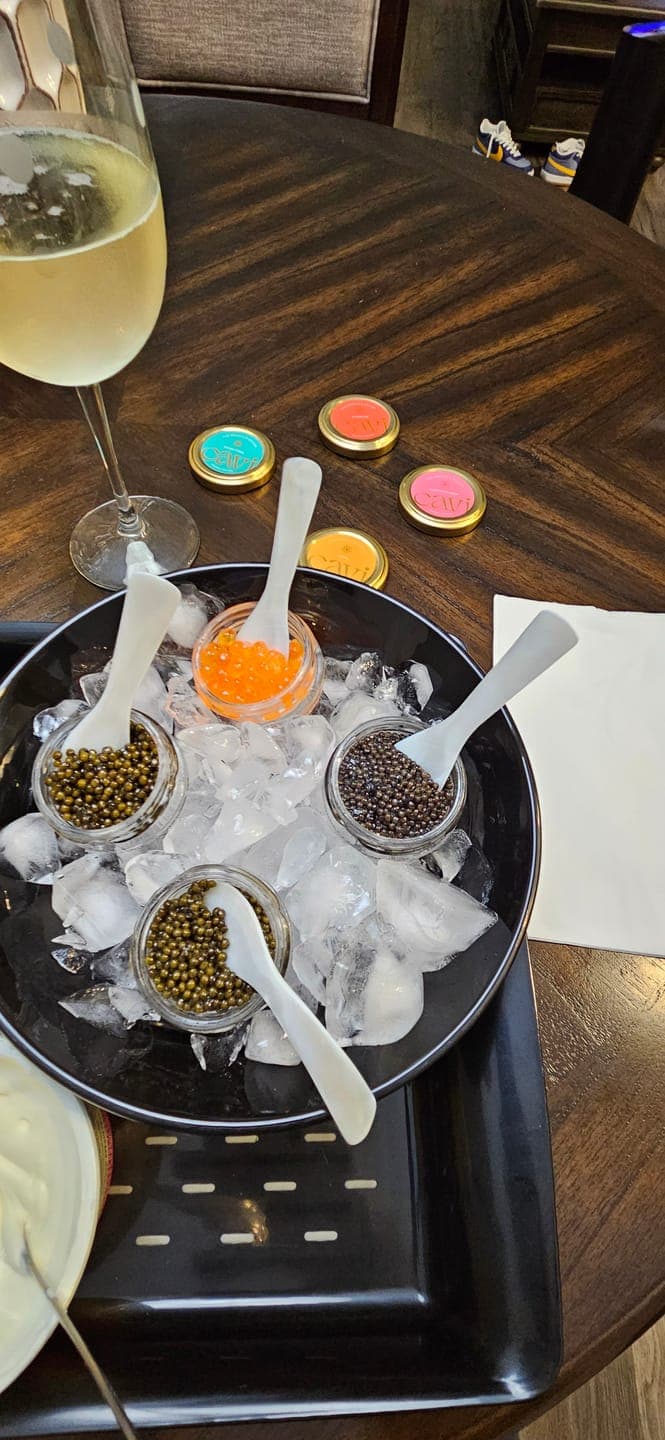 Customer's tasting of Siberian Sturgeon Caviar and other varieties from a kit, served in glass jars on ice.