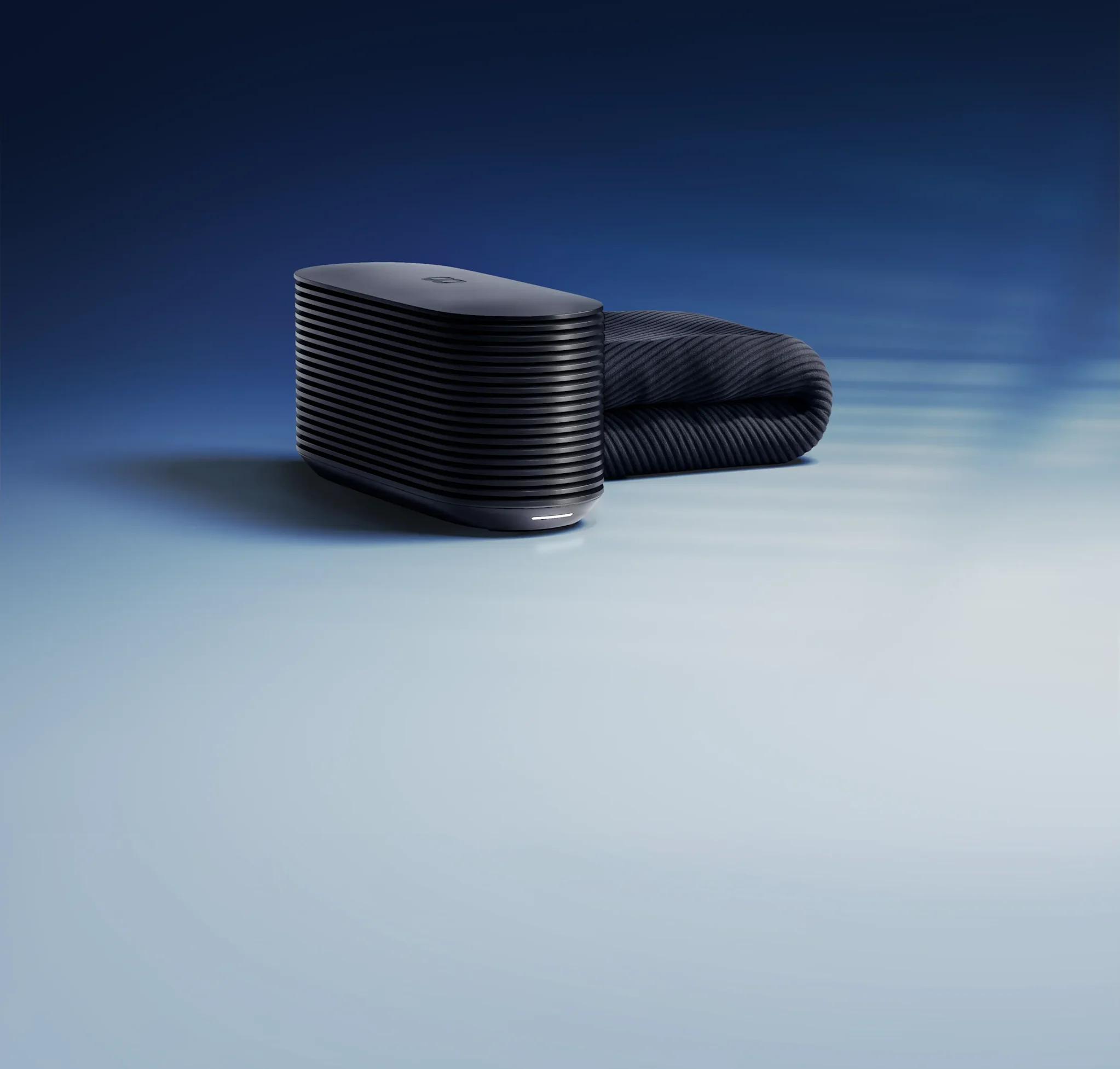 The Pod 6 Hub beside a folded Cover, against a blue sky