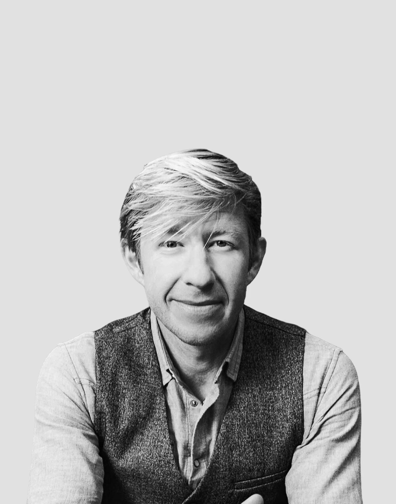 Matthew Walker, in a black and white studio portrait