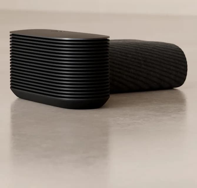 The Pod 6 Hub on a floor beside a rolled Pod Cover