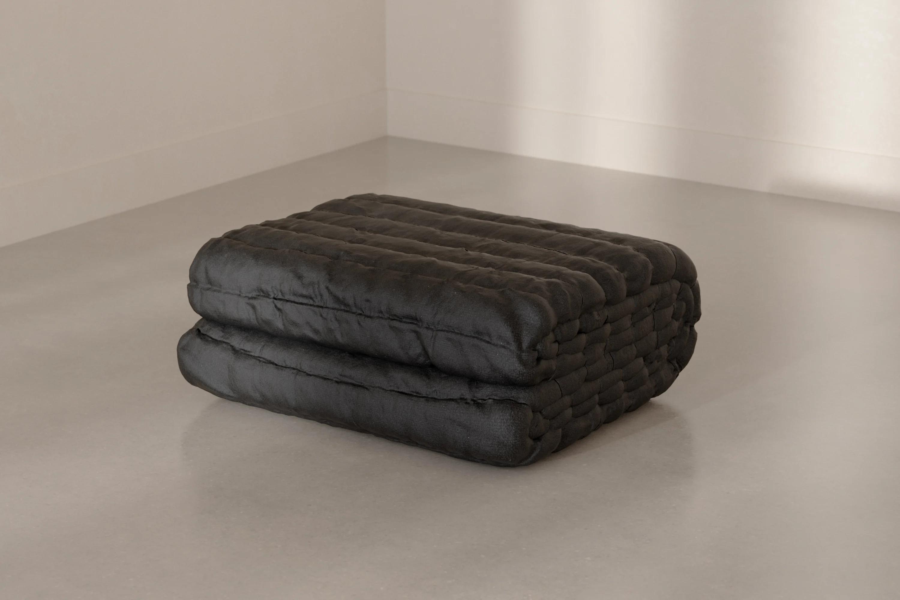 The Blanket folded in a bright room.