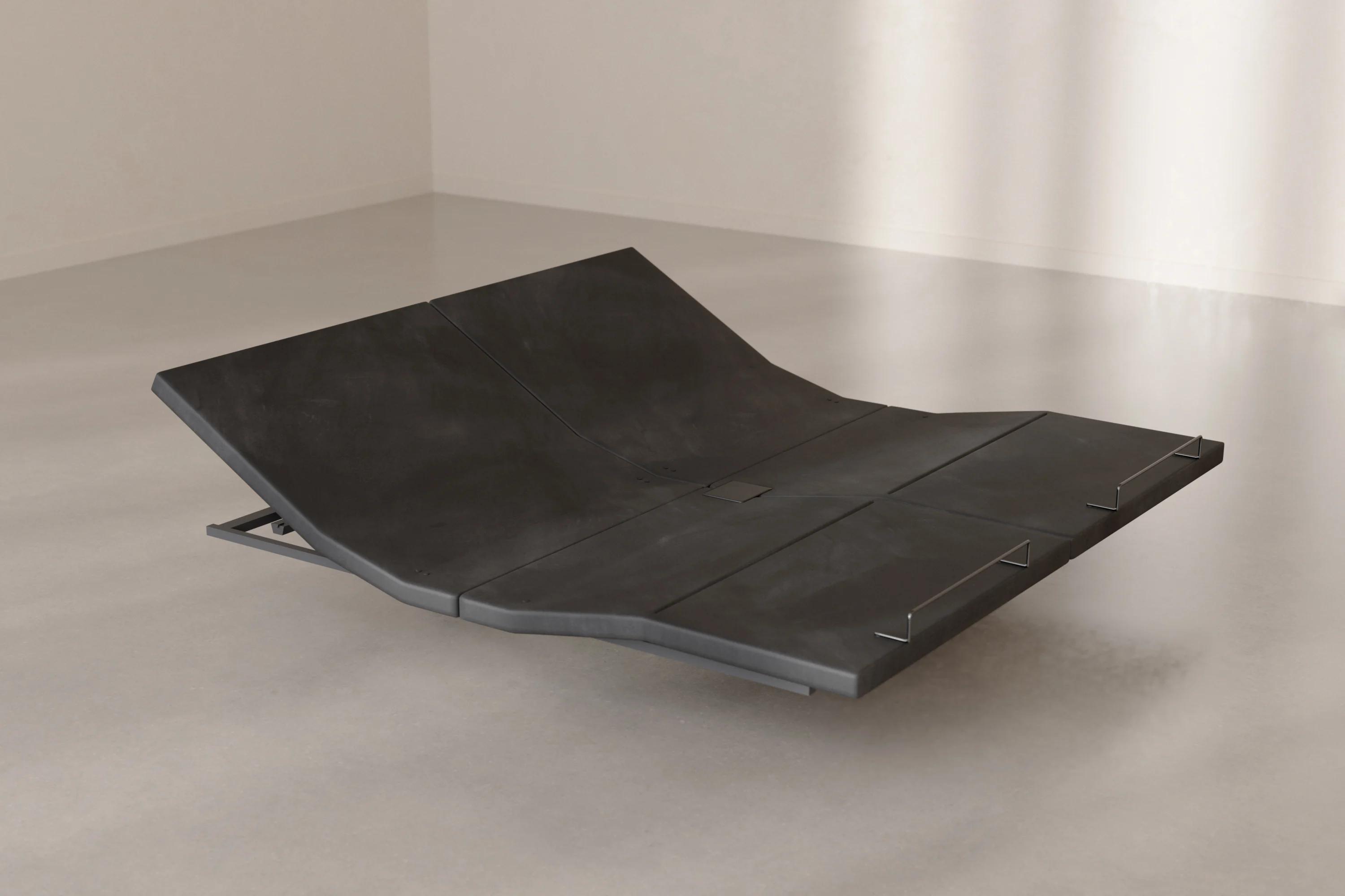 The Base articulated at the head and foot, resting on the floor in a bright room.