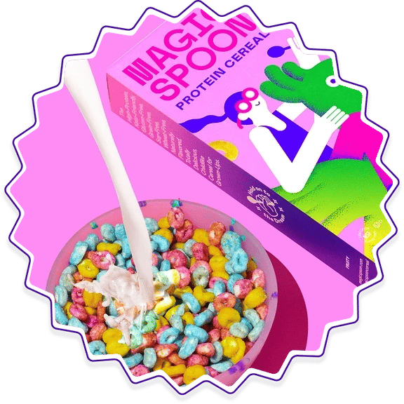 Box of Magic Spoon Protein Cereal beside a bowl of fruity cereal with milk pouring in