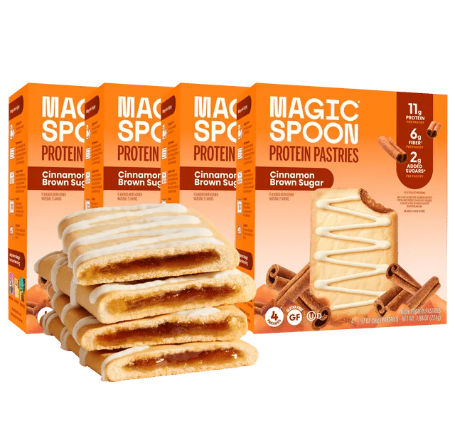 Boxes of Magic Spoon Cinnamon Brown Sugar Protein Pastries with a stack of pastries and cinnamon sticks