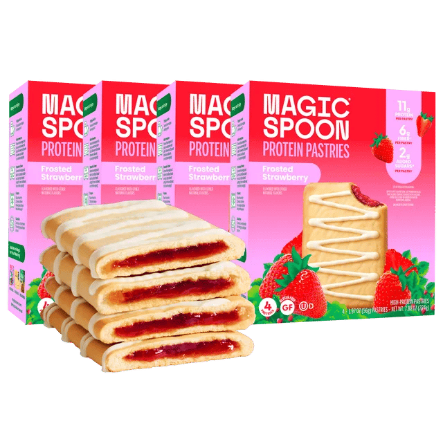 Boxes of Magic Spoon Frosted Strawberry Protein Pastries with a stack of pastries and strawberries