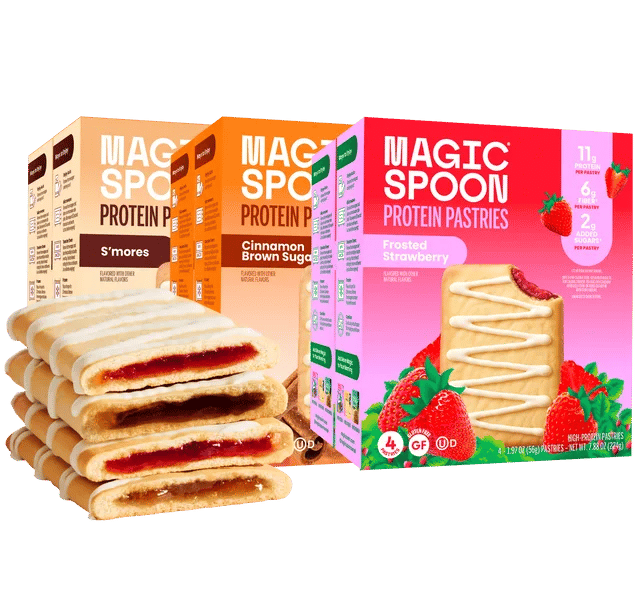 Boxes of Magic Spoon Protein Pastries in assorted flavors with a stack of frosted strawberry pastries