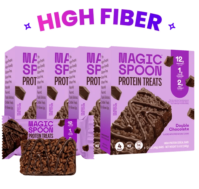 Boxes of Magic Spoon Double Chocolate Protein Treats with an unwrapped treat