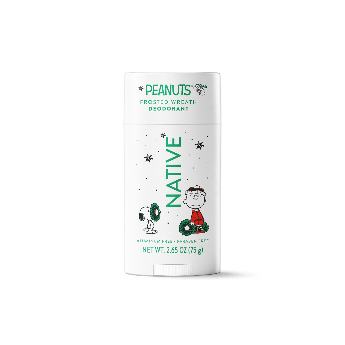 A 75 g aluminum-free, parabens-free Peanuts Frosted Wreath Deodorant stick by Native. The white container features green and black holiday-themed graphics including Snoopy and Charlie Brown with a wreath, set against a clean white background with a soft shadow.