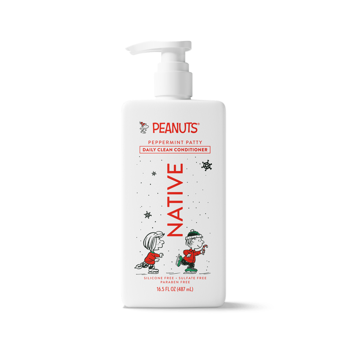 A bottle of Peanuts Peppermint Patty Daily Clean Conditioner with a white pump dispenser and a festive holiday-themed label featuring Snoopy and Woodstock.