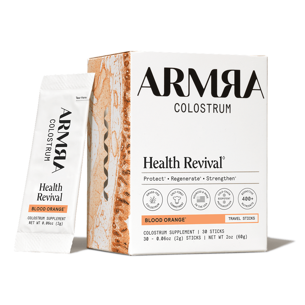 ARMRA Colostrum Health Revival package on a black background