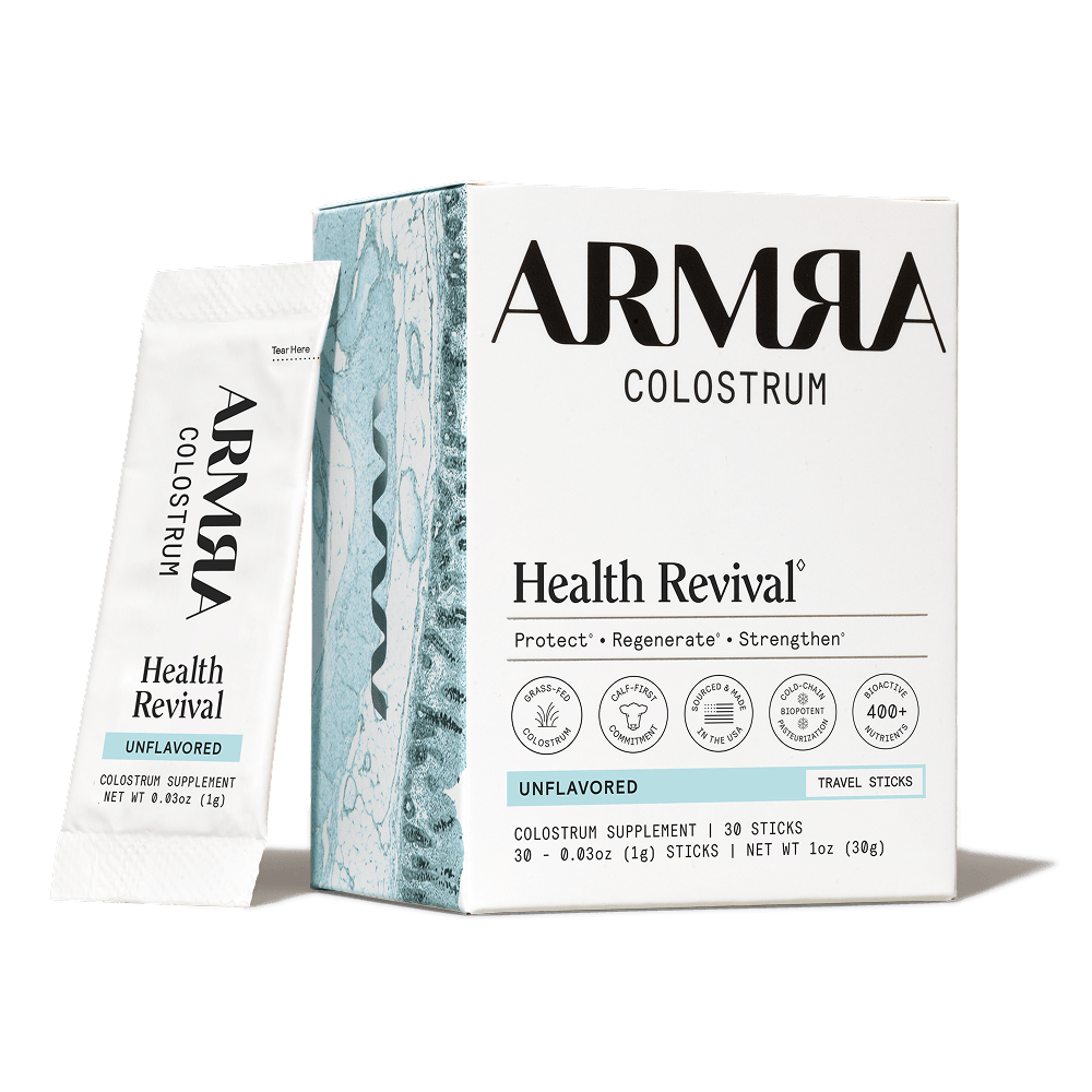 ARMRA Colostrum Health Revival packaging on a black background