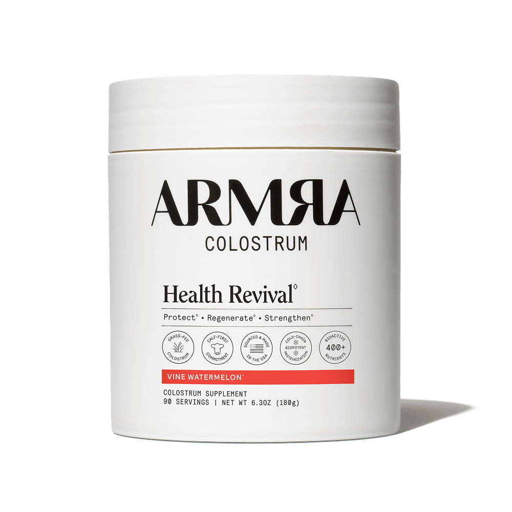 ARMRA Colostrum Health Revival supplement container on a black background