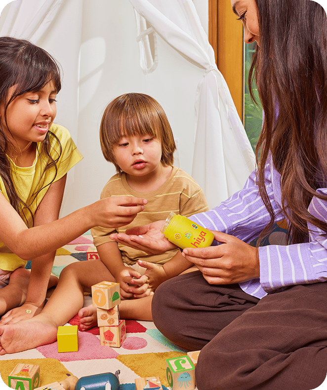 Parent playing with two children