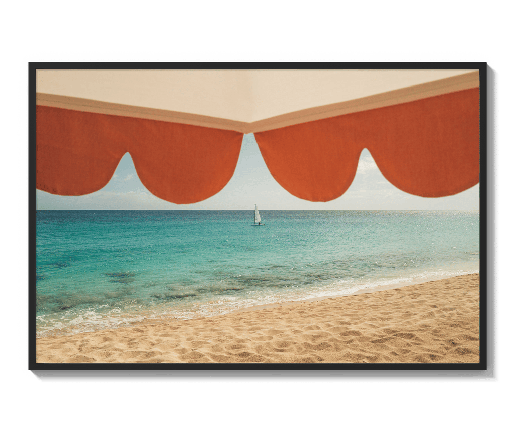 Framed beach print hanging in an exhibition