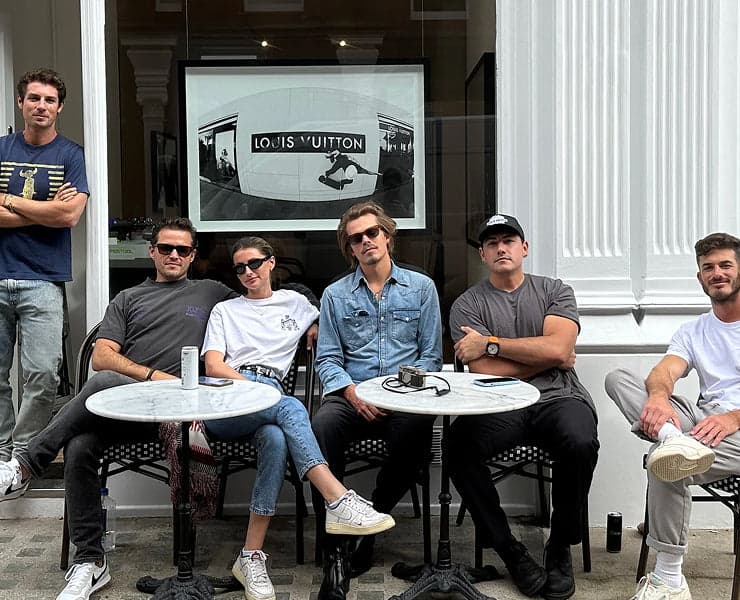 The House of Spoils team seated outside the gallery storefront