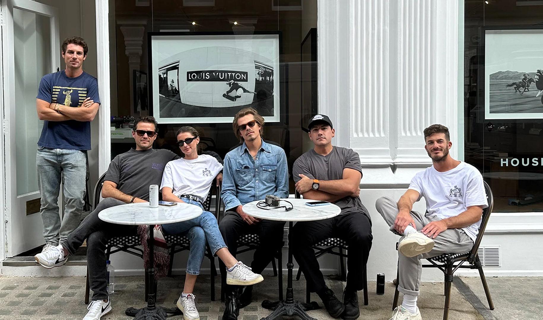 The House of Spoils team seated outside the gallery storefront