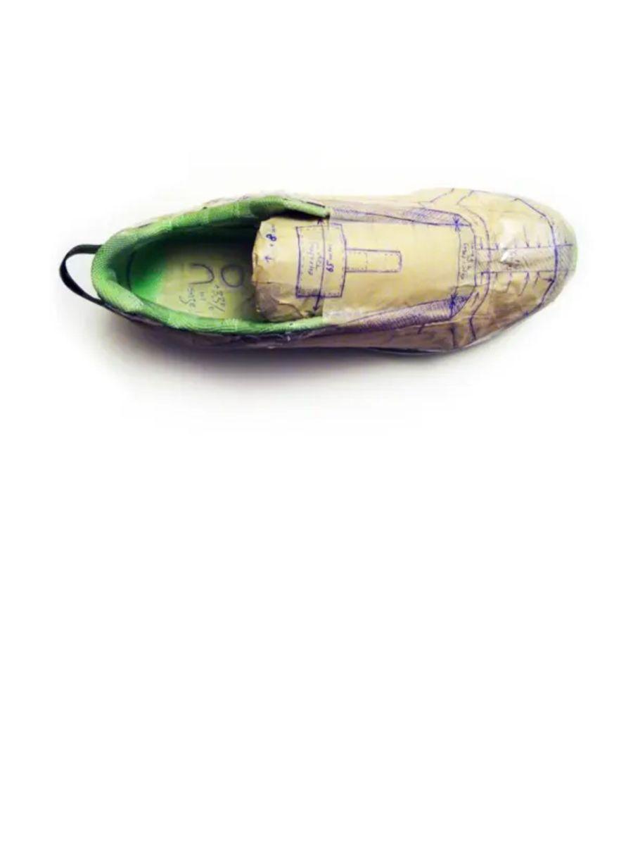 Prototype shoe with ink drawings all over it.
