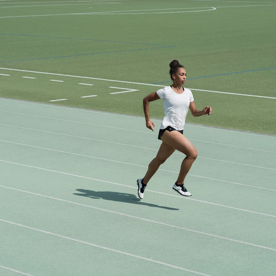 Runner on a track wearing On shoes