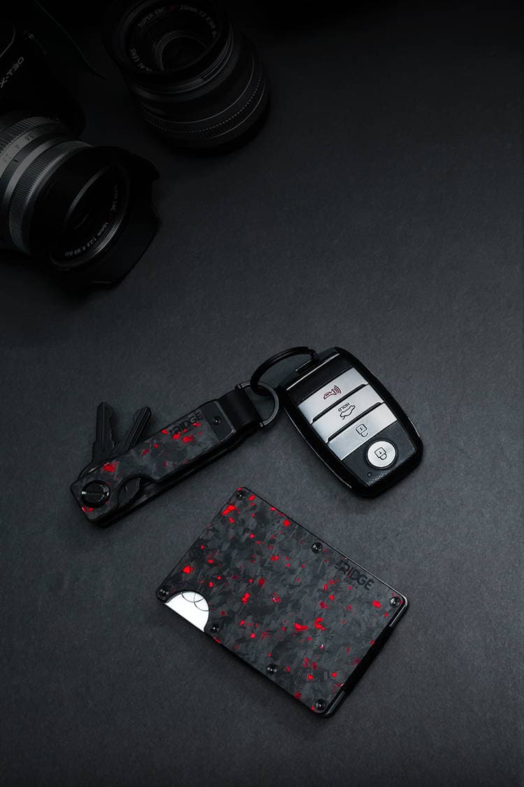 Everyday carry gear laid out on a dark surface