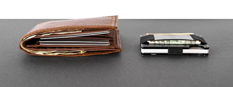 A traditional bulky wallet next to the slim Ridge wallet