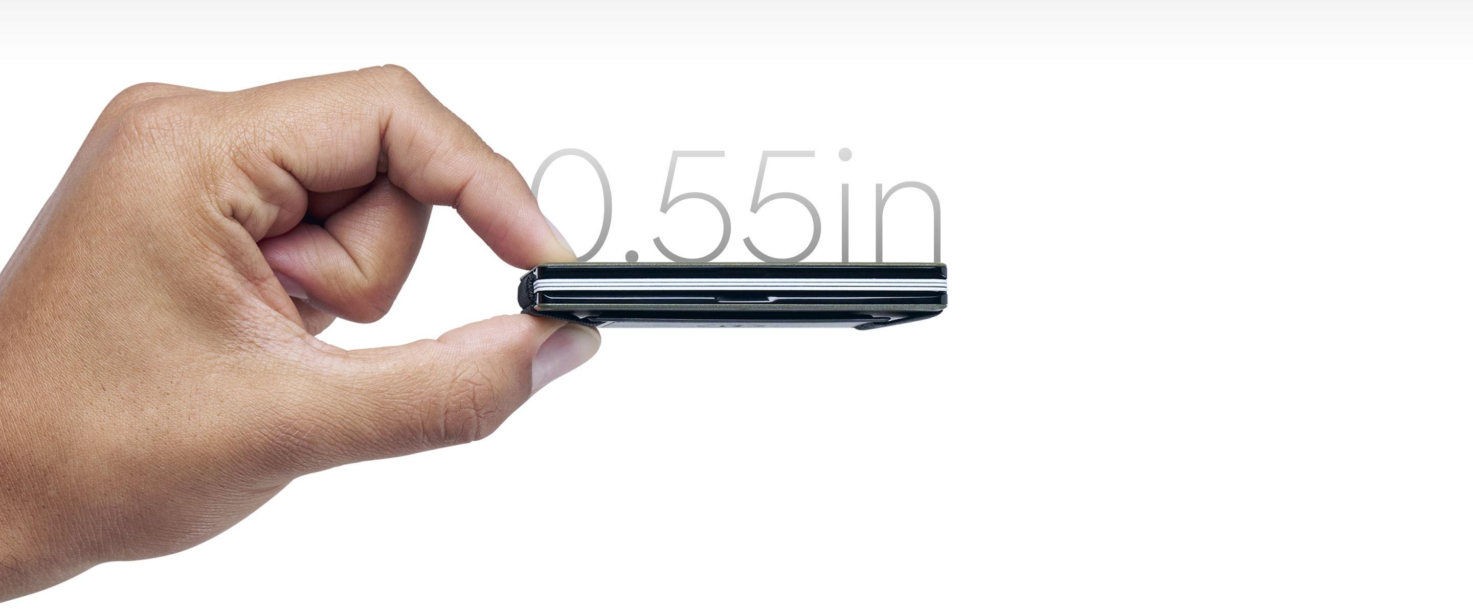 Hand holding Ridge wallet with 0.55in measurement
