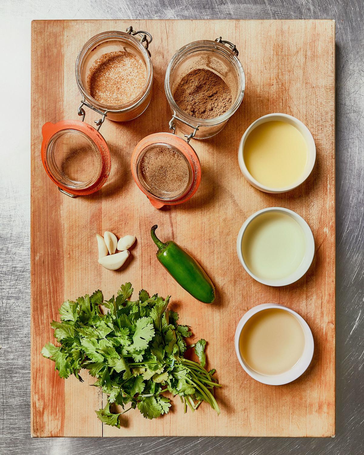 Cashew dressing ingredients on a wooden cutting board