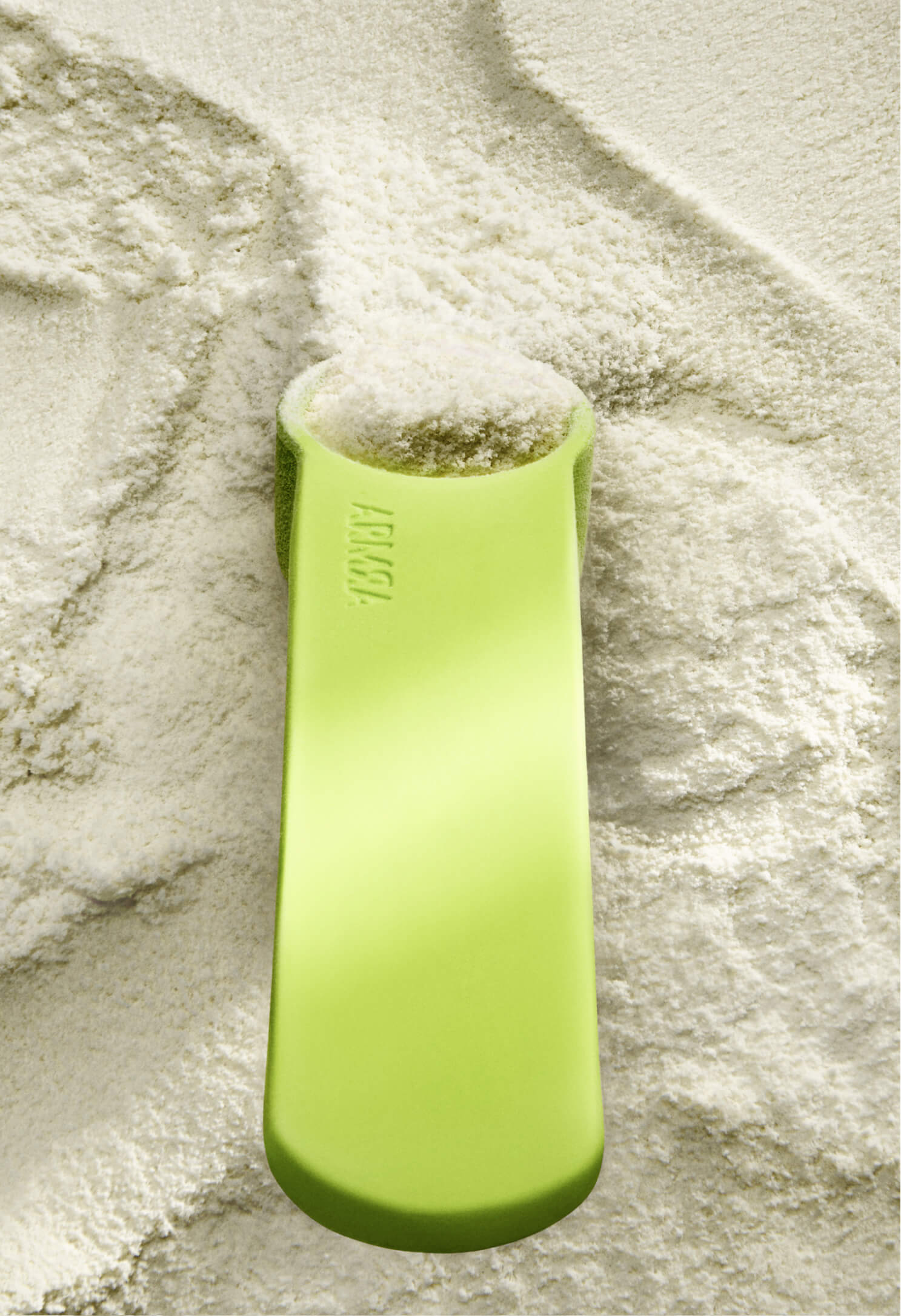 Green silicone scoop on colostrum